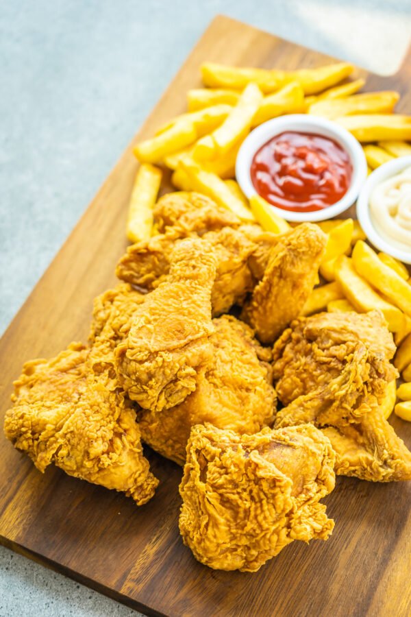 Fried chicken wings with french fries and tomato or ketchup and Fried Chicken
