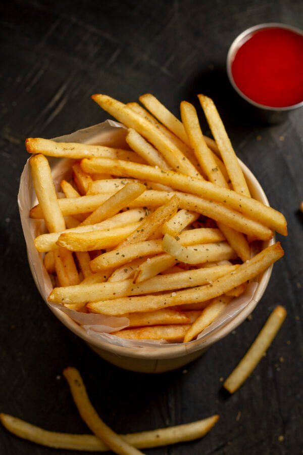 top-view-delicious-fries-sauce Deli Chips